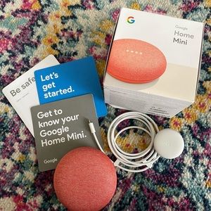 NEVER USED. STILL IN ORIGINAL BOX. GOOGLE HOME IN PRETTY PINK COLOR.